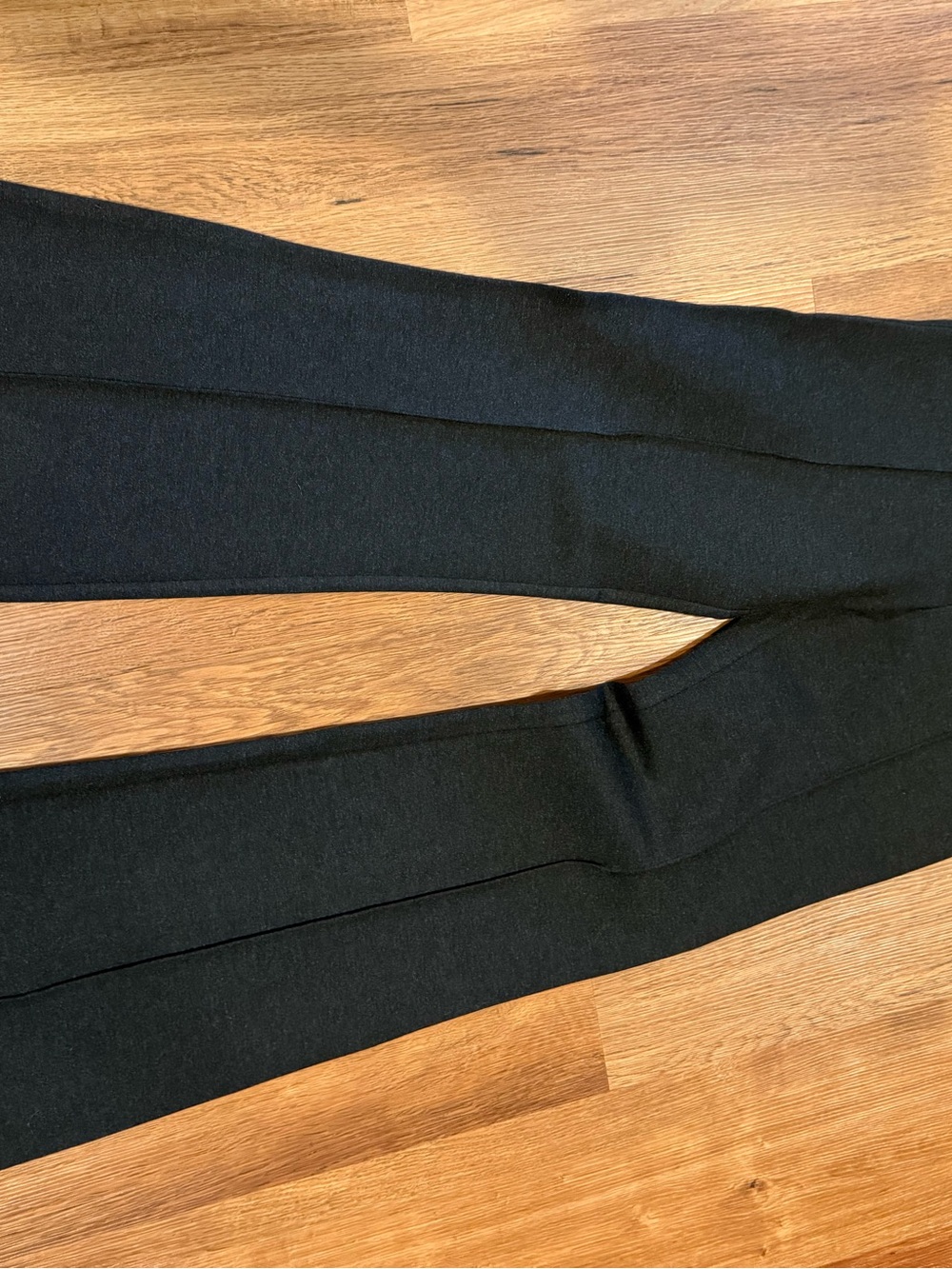 SPANX Black Garment with Red Brand Tag
